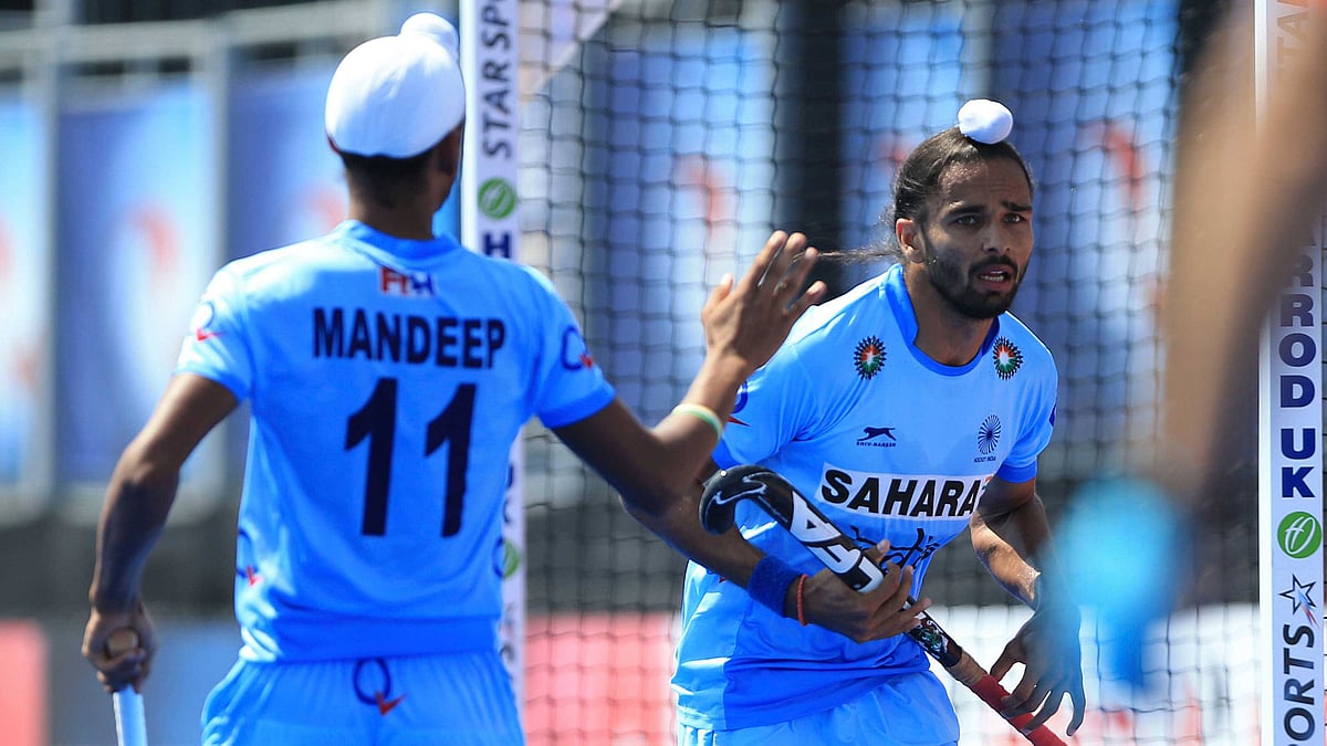 India’s Akashdeep Singh (right) celebrates scoring his side’s first goal of the game against Netherlands during the Men’s World Hockey League match. (Photo: AP)