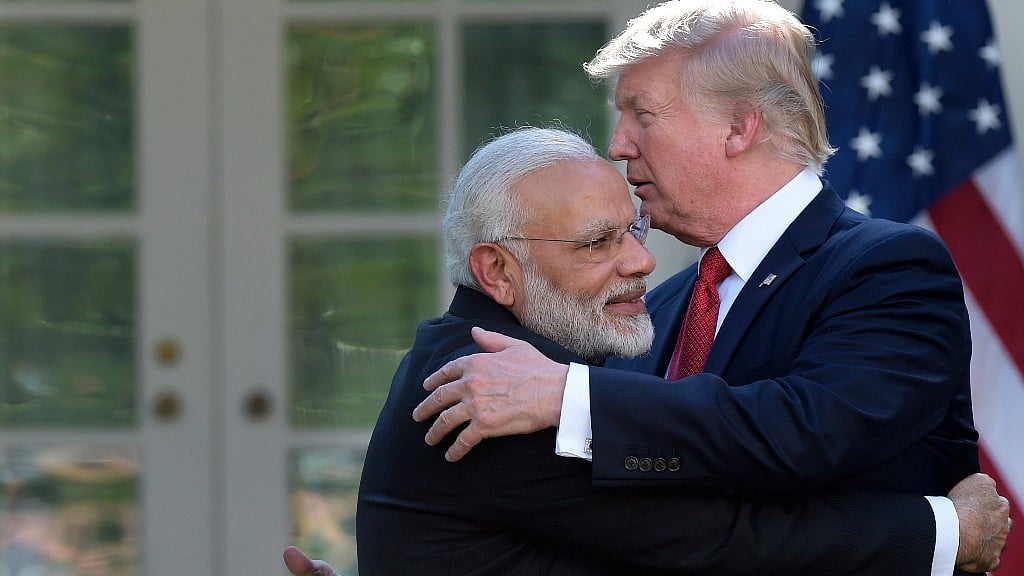 President Donald Trump and Indian Prime Minister Narendra Modi hug during a public address in the Rose Garden of the White House in Washington. 