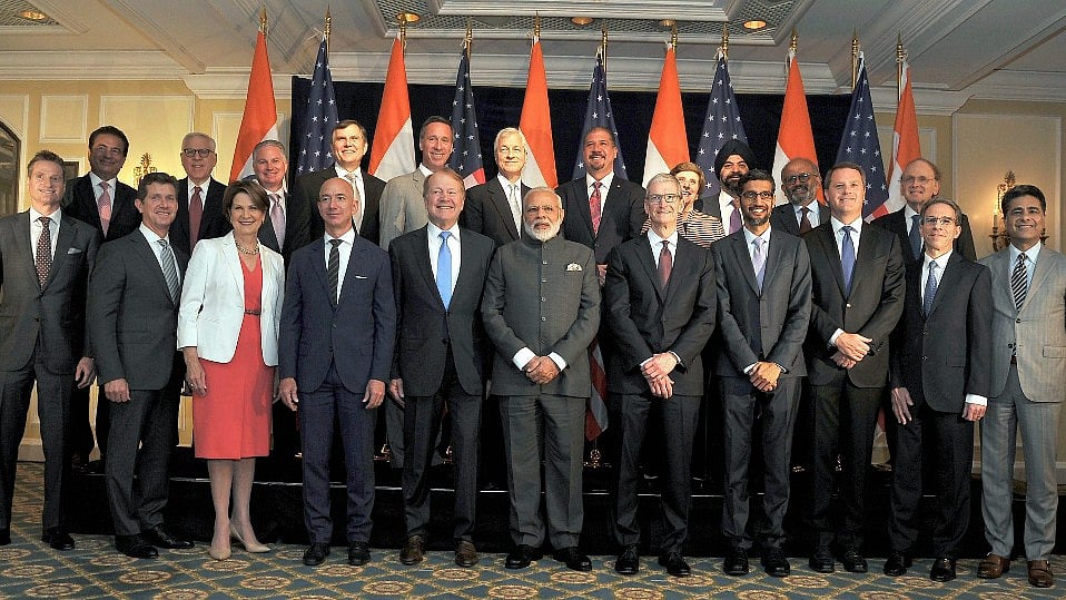 Prime Minister Narendra Modi poses for a group photograph with US business leaders at a meeting in Washington DC, USA on Sunday. 