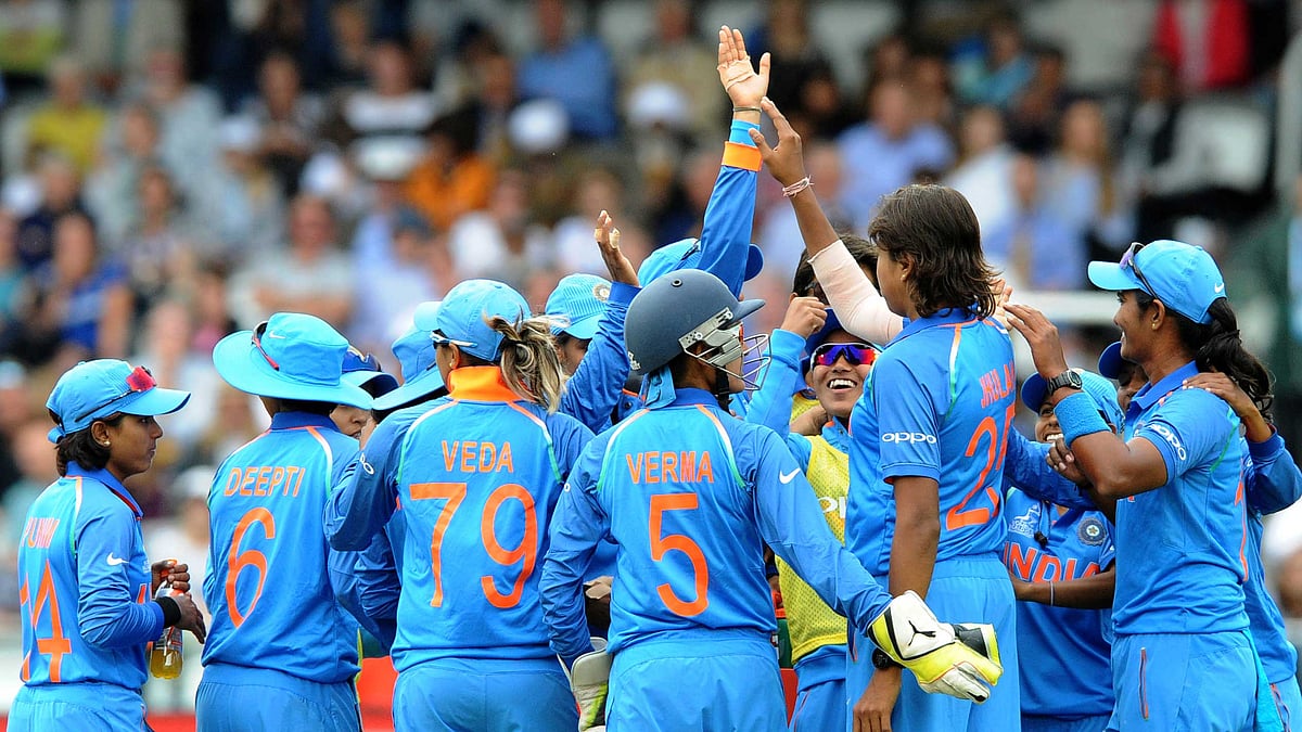 The Indian team celebrates a wicket during a match in the World Cup.