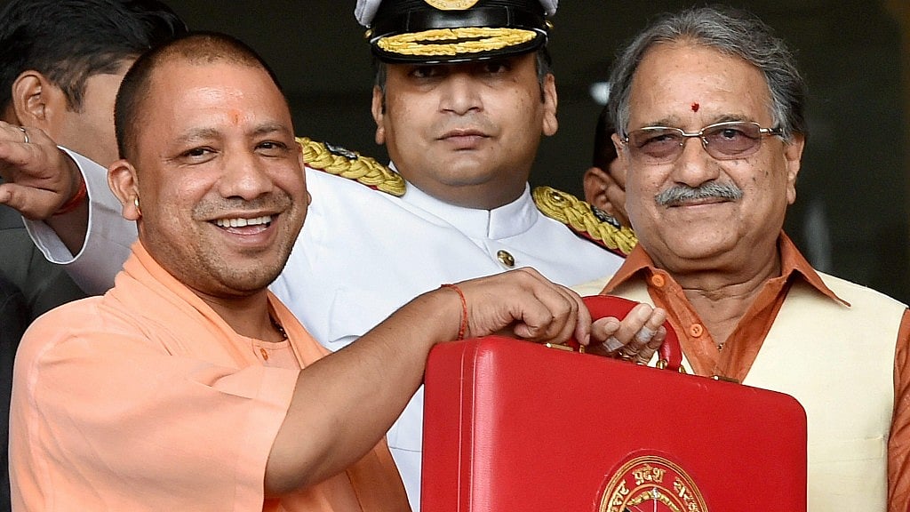 Uttar Pradesh Chief Minister Yogi Adityanath along with Uttar Pradesh Finance Minister Rajesh Aggarwal before presenting the State Budget for 2017-18, at Vidhan Sabha in Lucknow. 