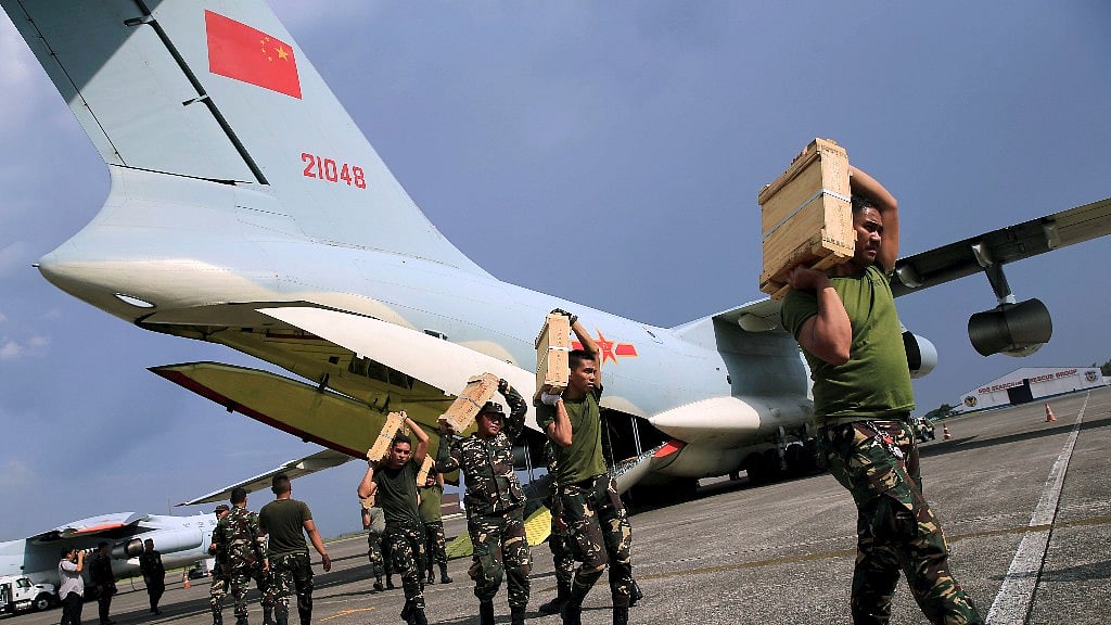 Government soldiers unload boxes of ammunition from a People’s Republic of China cargo plane in Philippines. Photo used for representational purposes.
