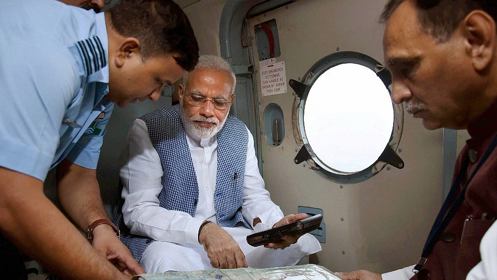 Prime Minister Narendra Modi with Gujarat CM Vijay Rupani during an aerial survey of flood affected areas of Banaskatha districts of Gujarat on Tuesday. 