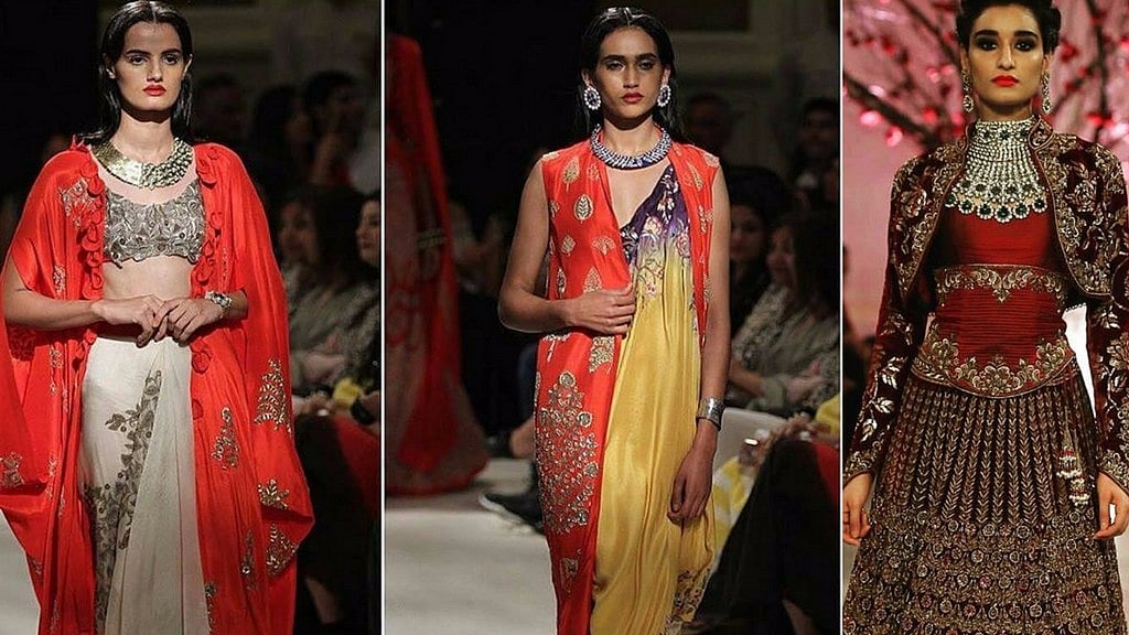 Models displaying pieces from an earlier Anamika Khanna collection, and a piece from Rohit Bal’s Kehkashaan collection that was unveiled at last year’s India Couture Week. 