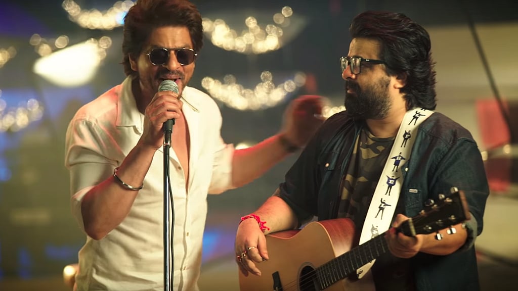 Shah Rukh Khan and music director Pritam in a still from the song <i>Safar</i>.
