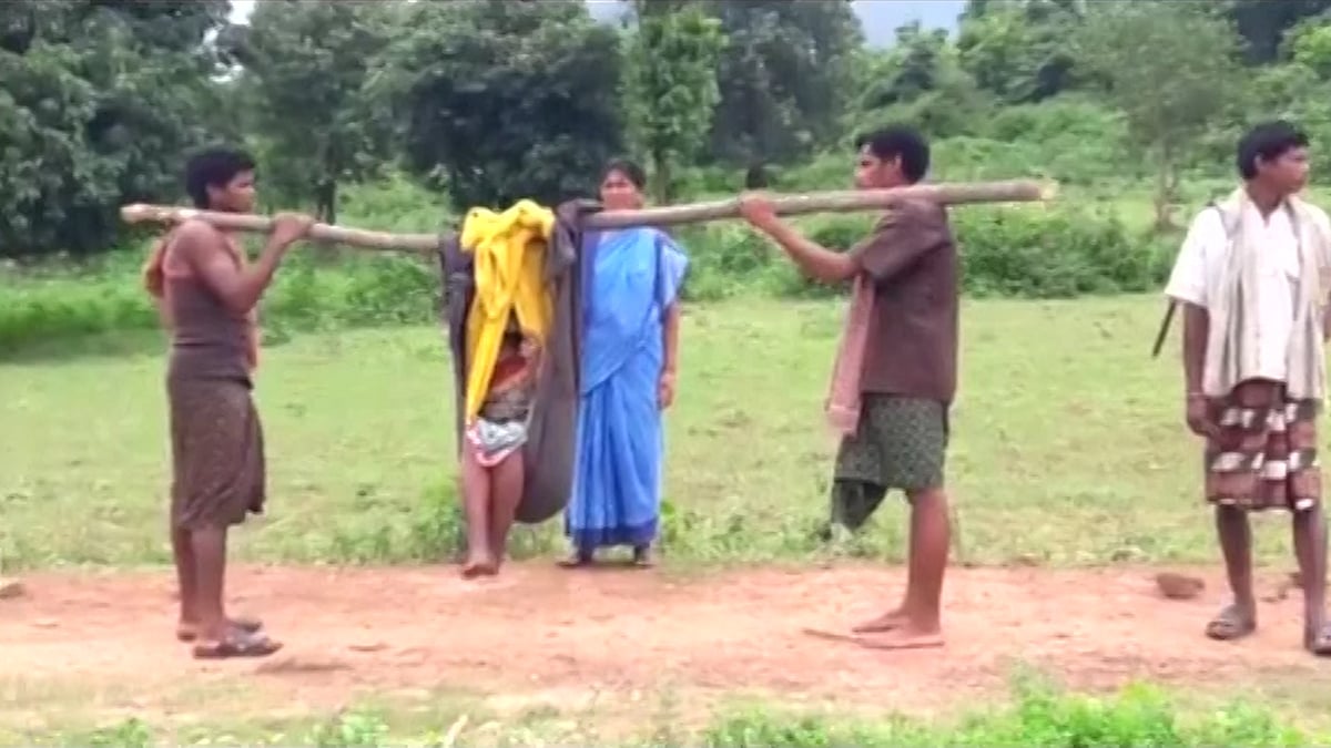 

A pregnant woman was carried to the hospital on a makeshift bamboo shaft.