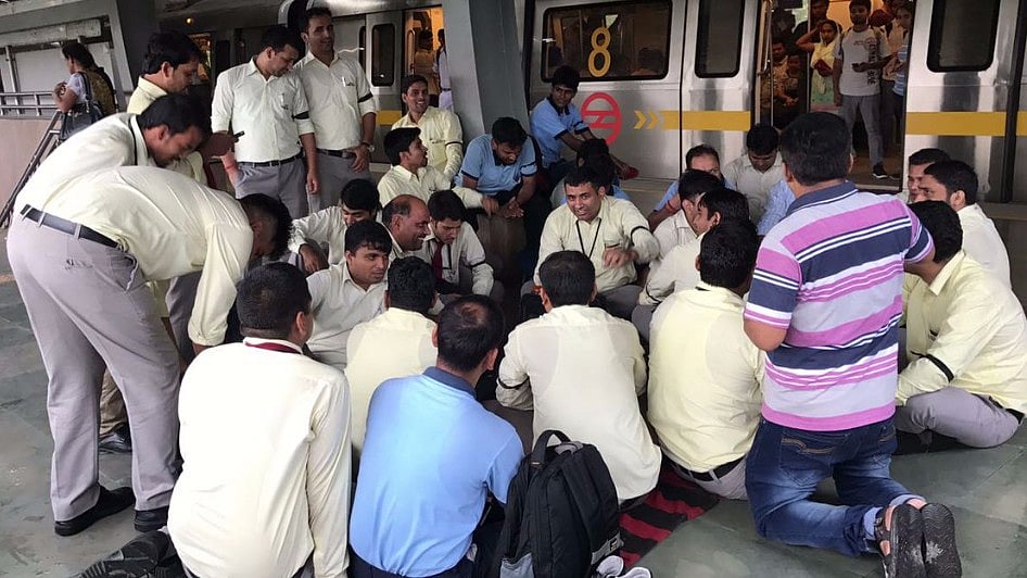 DMRC officials sit on strike at Yamuna Bank metro station on Saturday. 