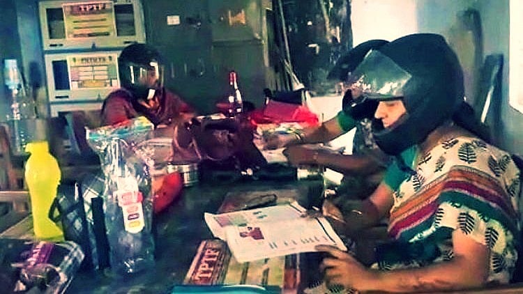 Guess why these teachers wore helmets to their school? (Photo Courtesy: The News Minute)