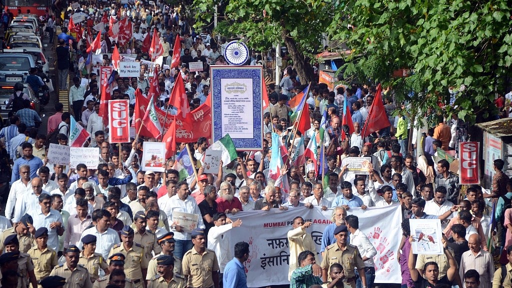 People participating in a rally against mob lynching. 