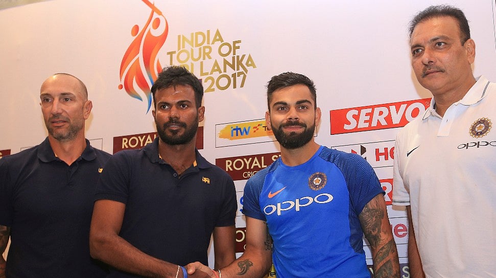 Sri Lanka’s interim head coach Nic Pothas, Upul Tharanga, Virat Kohli and Ravi Shastri pose for a picture ahead of a press conference in Colombo on Thursday.