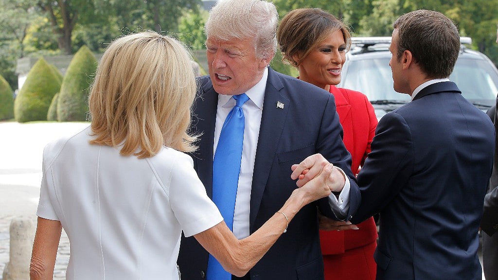 After repeating the comment to the president, Trump turned back to Brigitte Macron and said: “Beautiful.” (Photo: Reuters)