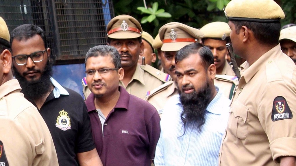 Men accused in a case relating to a suicide bomb blast at a police building in 2005 outside a court after getting acquitted in Hyderabad.