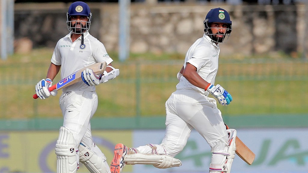 Cheteshwar Pujara and Ajinkya Rahane take a run during day one of the Colombo Test.