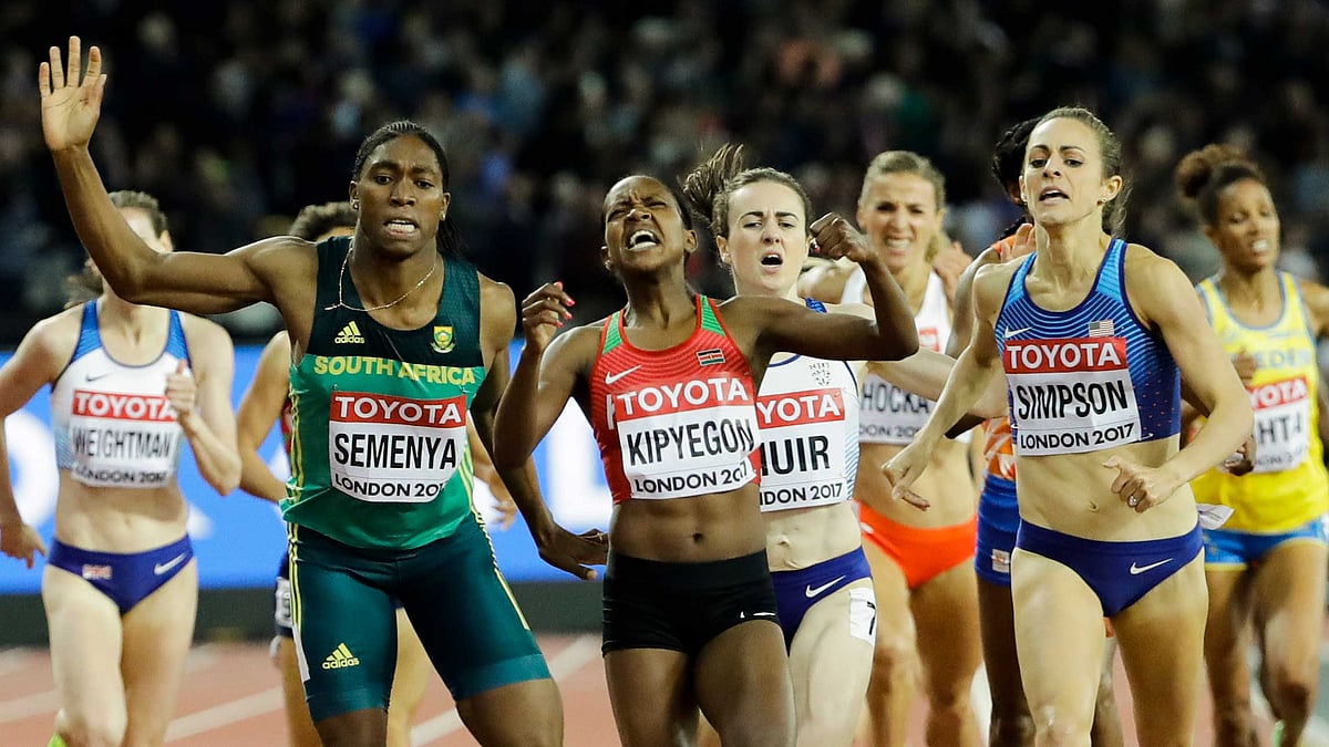 Kenya’s Faith Chepngetich Kipyegon, center, celebrates as she wins the gold medal in the final of the Woman’s 1500m during the World Athletics Championships in London