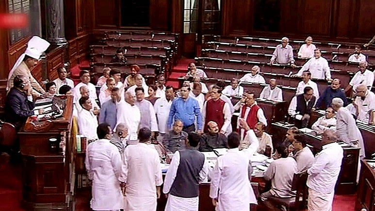 Congress MPs in Rajya Sabha’s Well during the ongoing monsoon session of Parliament