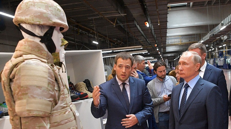 President Vladimir Putin looking at a Military uniform