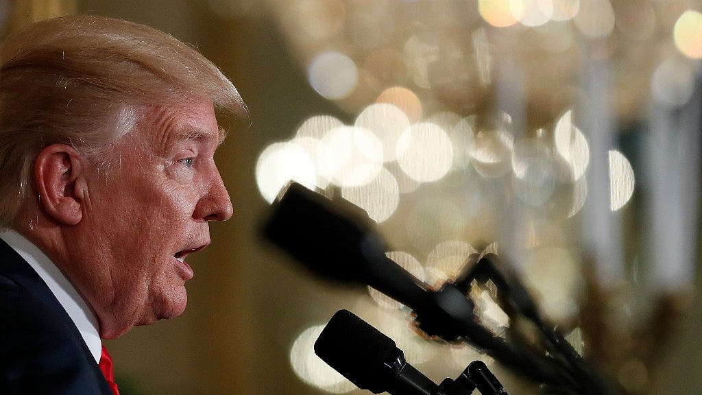Trump offered a sunny assessment of the response efforts while the rain was still pouring down on Houston.