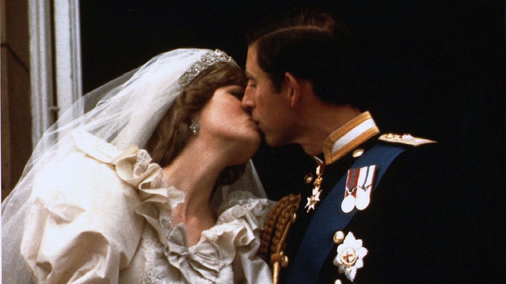 Prince Charles kisses his new bride Diana on their wedding day 29 July 1981