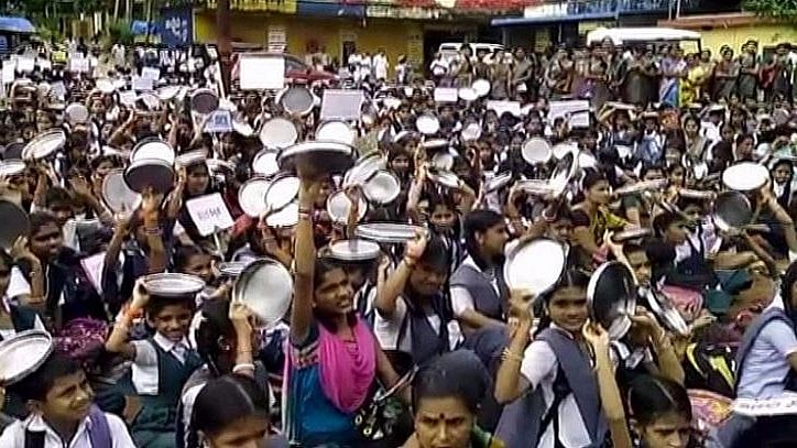 Hundreds of parents and students gathered on BC Road in Bantwal and shouted slogans.