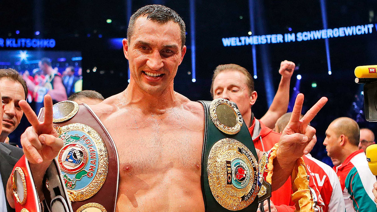 In this Nov. 15, 2014 file photo IBF, WBA, WBO and IBO champion Wladimir Klitschko from Ukraine celebrates after winning the IBF heavyweight world championships title bout against Bulgarian boxer Kubrat Pulev in Hamburg, Germany.&nbsp;