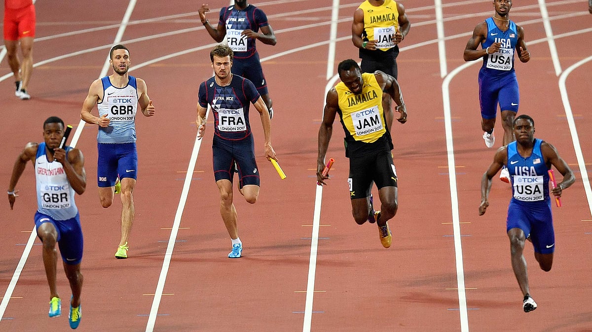 Jamaica’s Usain Bolt reacts as he pulls up injured in the Men’s 4x100 meters relay final at the World Athletics Championships in London