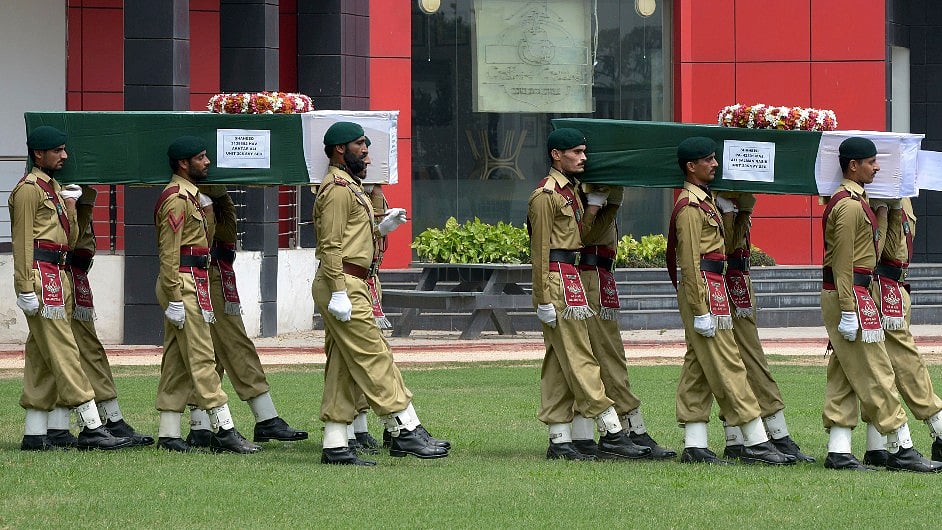 Pakistan Army carrying the coffins of the deceased soldiers. (Photo: Muhammad Sajjad/AP)