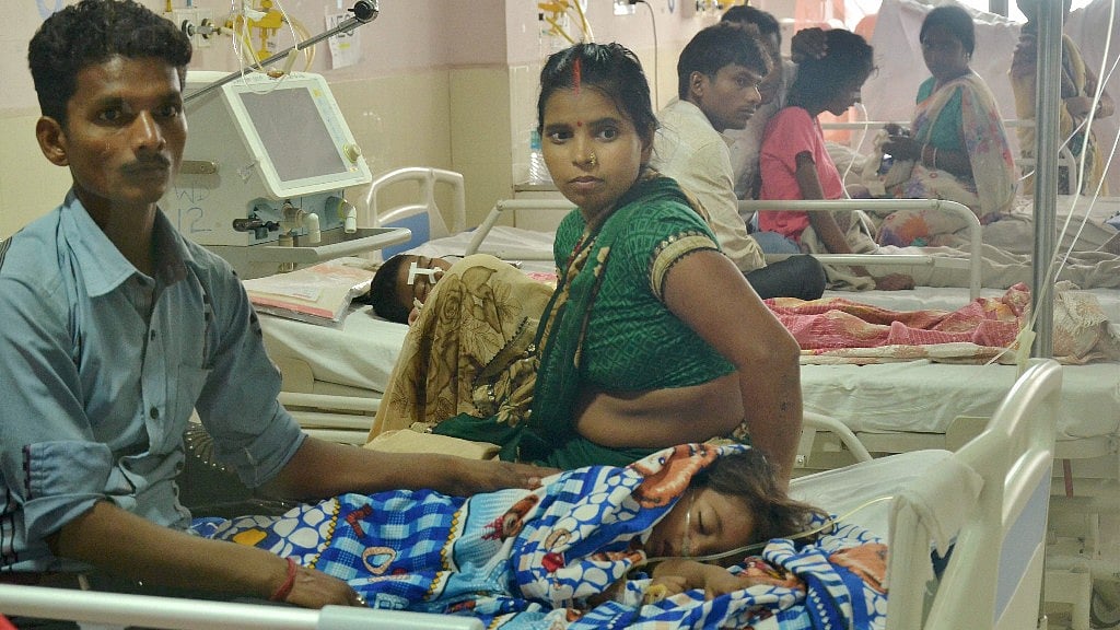Children receive treatment at the Baba Raghav Das Medical College Hospital in Gorakhpur district on Sunday. 