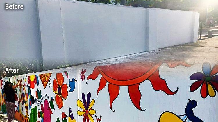 Armed with paint brushes, volunteers unleashed their creativity on a drab-looking wall. 