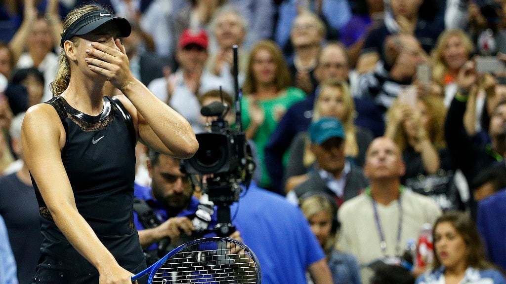 Maria Sharapova reacts after upsetting second seed Simona Halep in their opening round match in the US Open tennis tournament in New York on 28 August 2017.