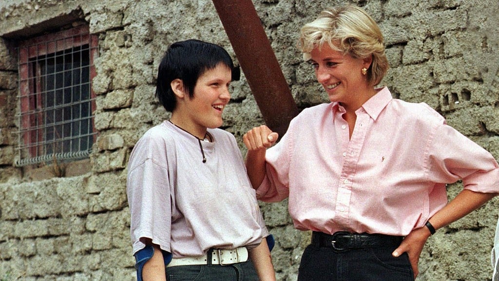 In this file photo dated 10 August 1997, Princess Diana chats with 15-year old landmine victim Mirzeta Gabelic in Sarajevo.
