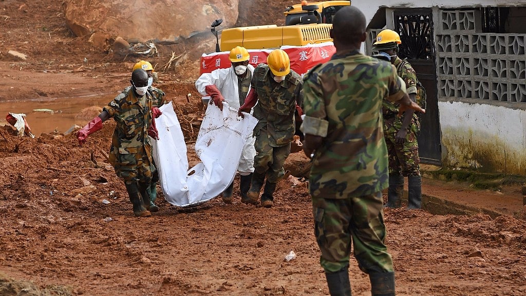 

Bodies of the mudslide victims are transferred out of the site of the mudslide in Freetown, capital of Sierra Leone, on 17 August 2017.