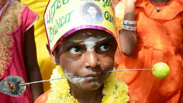 A child being used in a prayer procession for former Tamil Nadu Chief Minister J Jayalalithaa’s.