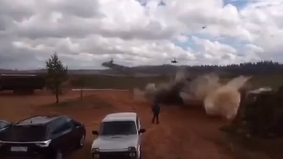 A video capturing the freak accident shows two helicopters approach a hill, by which the crowd is stationed.