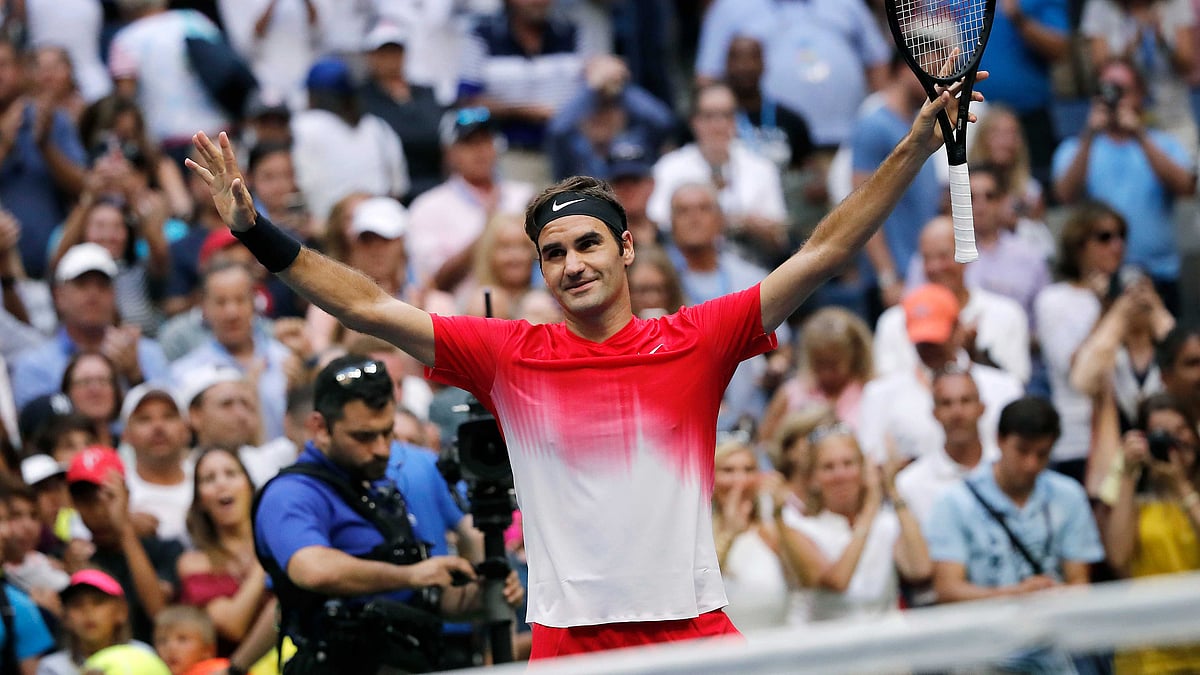 Roger Federer, of Switzerland, reacts after defeating Mikhail Youzhny, of Russia, during the second round of the U.S. Open