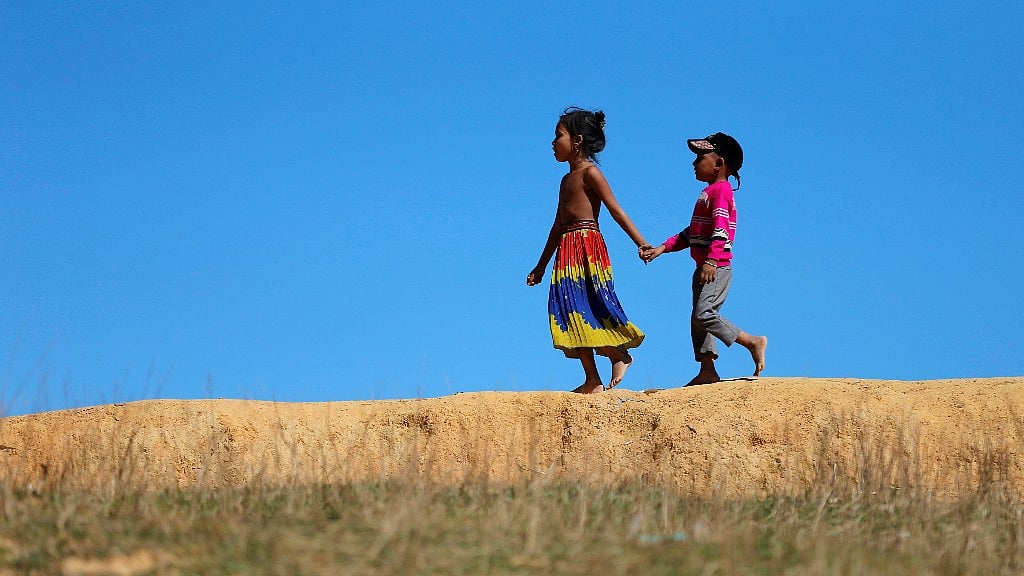 Rohingya children are seen as they walk near the Kutupalang Refugee Camp in Cox’s Bazar.