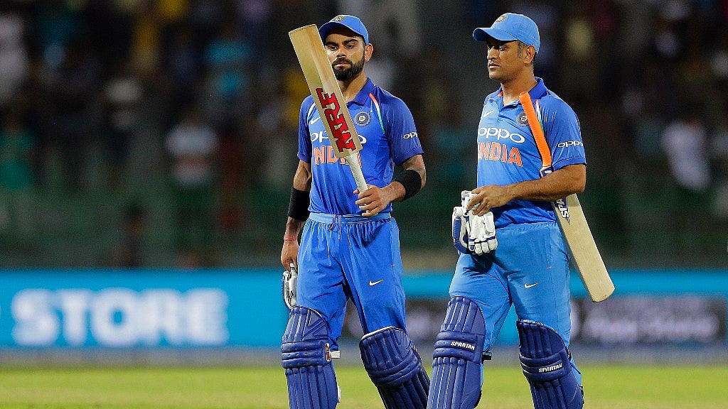 Virat Kohli (left) with MS Dhoni (right). 