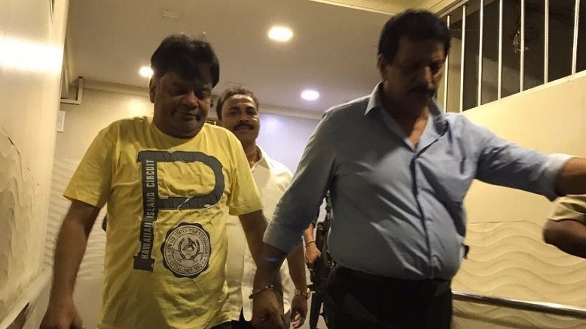 Dawood Ibrahim’s brother Iqbal Kaskar (left) being taken by the Maharashtra police.