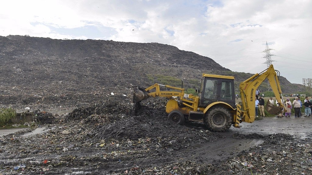 Rescue operations underway at the site where a huge part of a landfill collapsed in east Delhi’s Ghazipur on 1 September 2017.