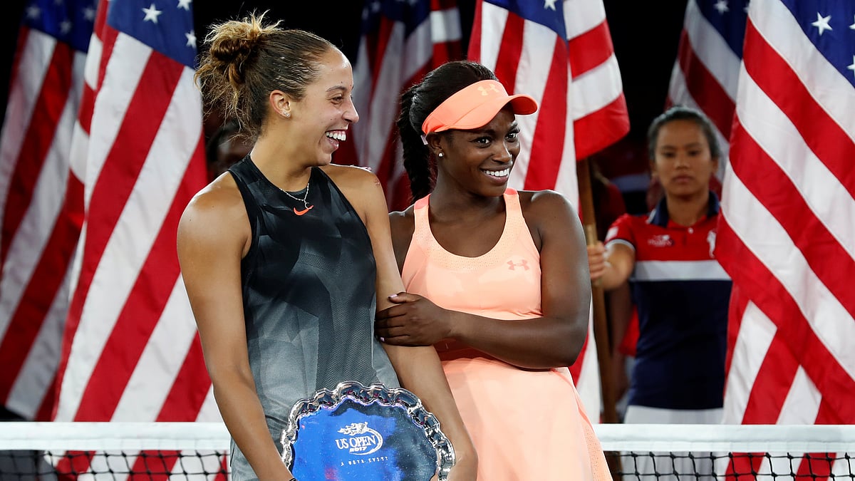 Champion Sloane Stephens of the United States with Madison Keys of the United States during the awards ceremony. 