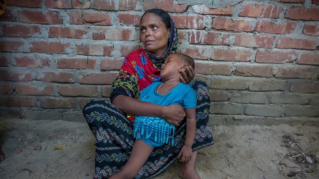 Ayesha Bibi, a Rohingya Muslim, grieves for her mother and two children after their boat capsized near Bangladesh.