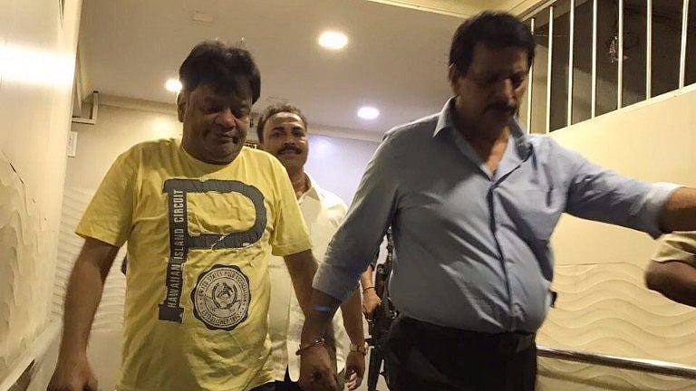 Dawood Ibrahim’s brother Iqbal Kaskar (left) being taken by the police.