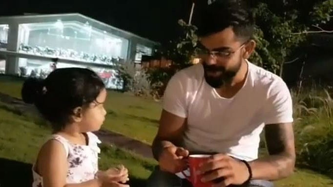 Ziva Dhoni with Virat Kohli.