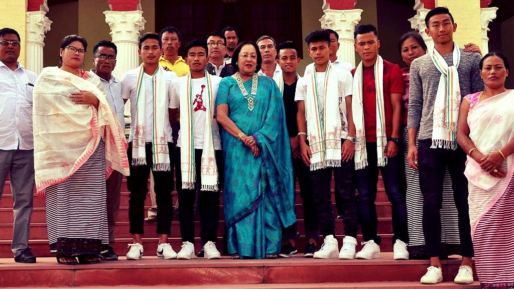 Imphal: Manipur Governor Najma Heptulla with the players of Indian FIFA U 17 World Cup 2017 during a felicitation ceremony in Imphal on Oct 16, 2017.&nbsp;