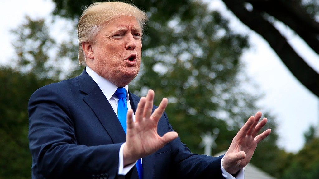President Donald Trump speaks to reporters on the South Lawn of the White House in Washington, on Friday, 13 October 2017. 