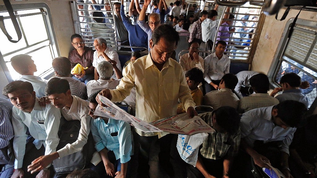 Commuters head to work onboard a Mumbai local train.&nbsp;