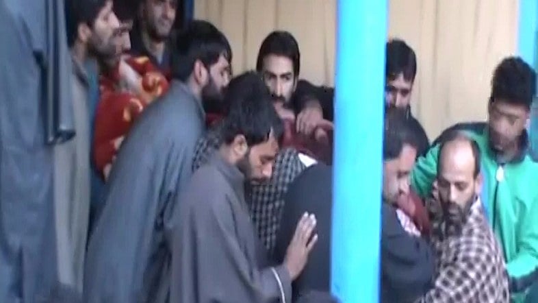 Body of slain PDP worker Ramzan Sheikh being carried away. <i>(Screenshot: ANI)</i>