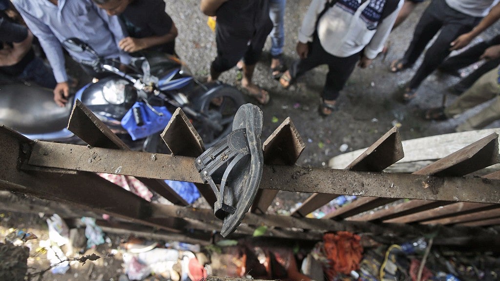 A victim’s sandal stuck on the fence of the Elphinstone station.