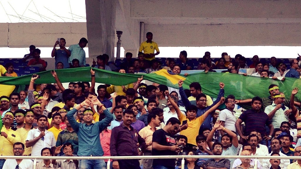 Kolkata: Football fans cheer during the FIFA U17 World Cup 2017 Semi Final match between Brazil and England at Salt Lake stadium in Kolkata, on Oct 25, 2017. 