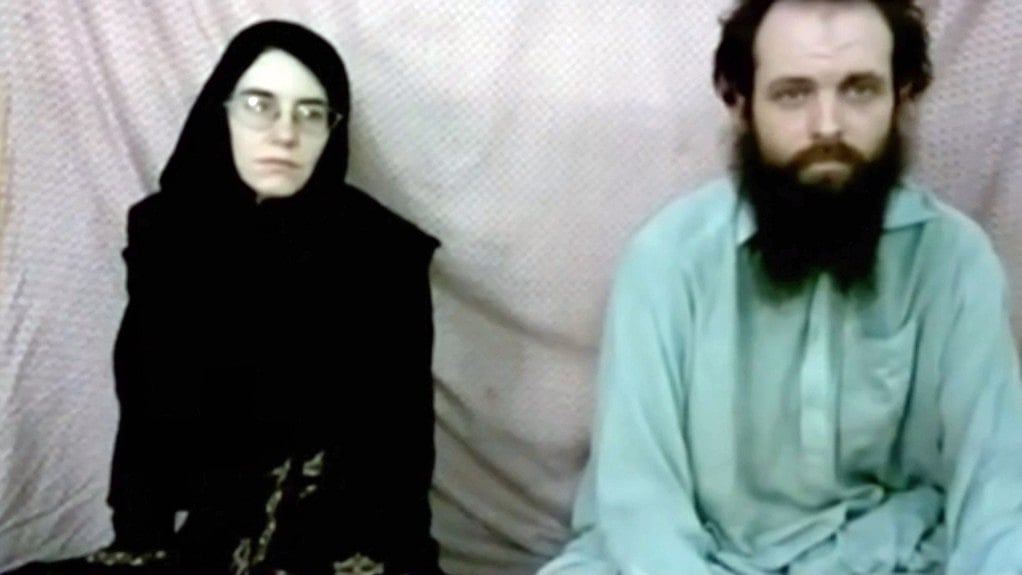 A still image made from a 2013 video released by the Coleman family shows Caitlan Coleman and her husband, Canadian Joshua Boyle in a militant video given to the family. 