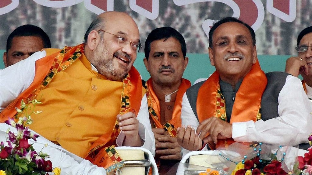 Gujarat Chief Minister Vijay Rupani with BJP President Amit Shah at a rally in Gujarat.